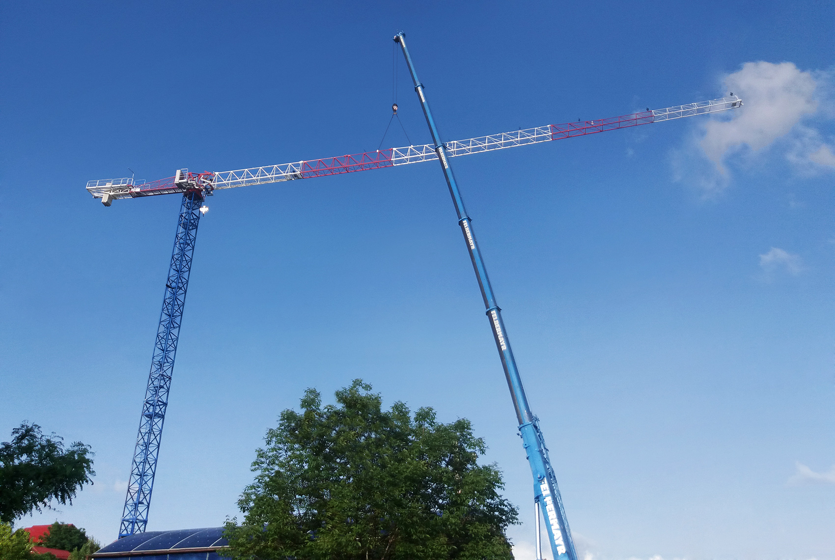 M Equipment: A Raimondi MRT159 flattop tower crane is currently at work in Romania on a residential jobsite