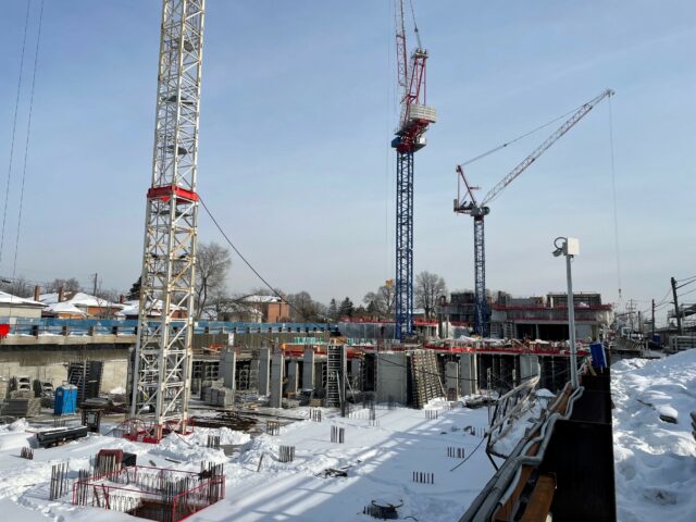 Two Raimondi LR273 luffing jib cranes participate in the build of new Toronto area cluster development